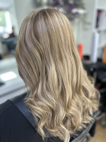 Blonde Balayage Woman with long past shoulder length Blonde Balayage hair