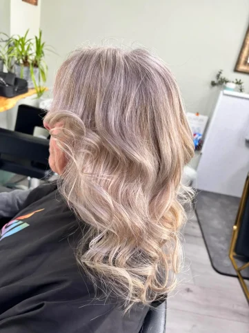 Ash blonde silver toner with soft waves on long hair - hair salon Huntington York
